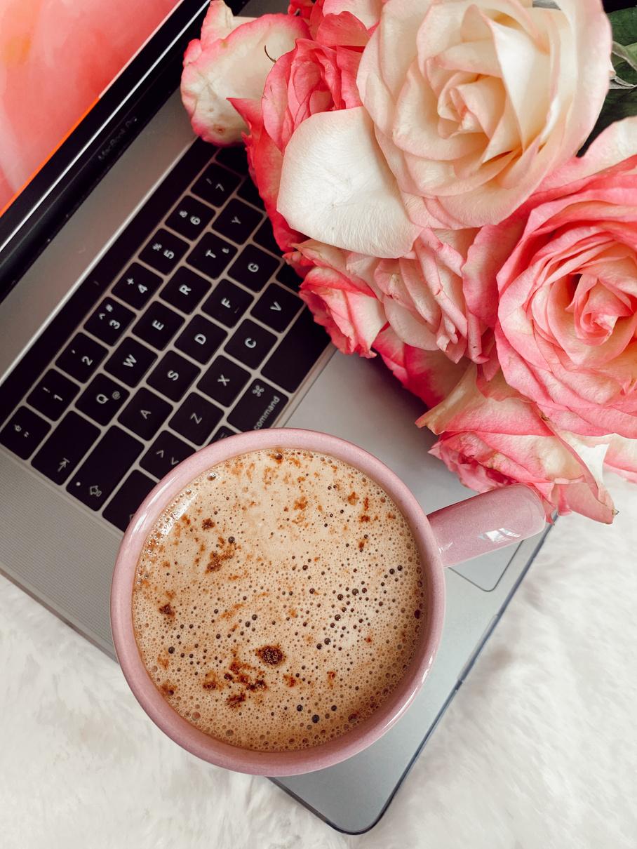 Coffee and roses on laptop